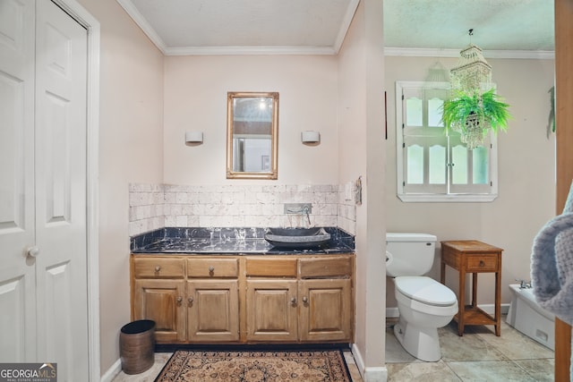 1009 Liberty Church Rd NE, Ranger, GA 30734 - bathroom featuring toilet, vanity, crown molding, tasteful backsplash, and baseboards