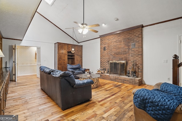 1009 Liberty Church Rd NE, Ranger, GA 30734 - living room with light wood-style flooring, ceiling fan, a fireplace, crown molding, and lofted ceiling