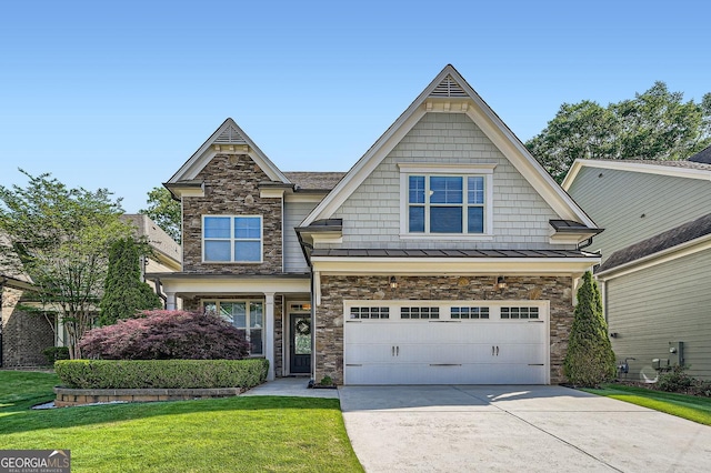 3699 School St, Chamblee, GA 30341 - craftsman inspired home with stone siding, concrete driveway, a standing seam roof, a front lawn, and an attached garage