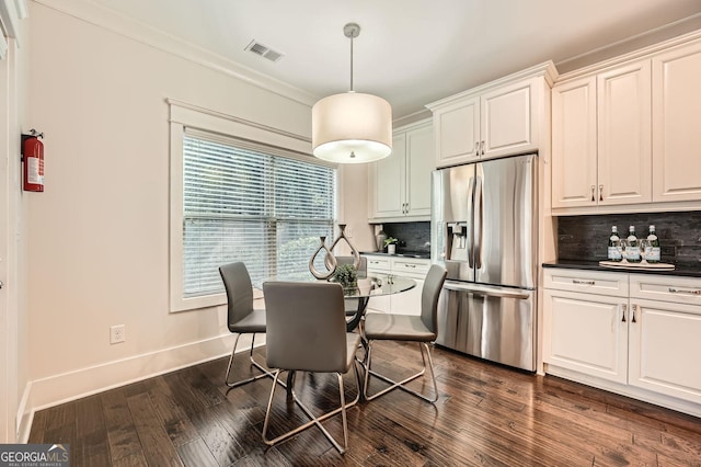 3699 School St, Chamblee, GA 30341 - dining room featuring ornamental molding and dark wood-style floors