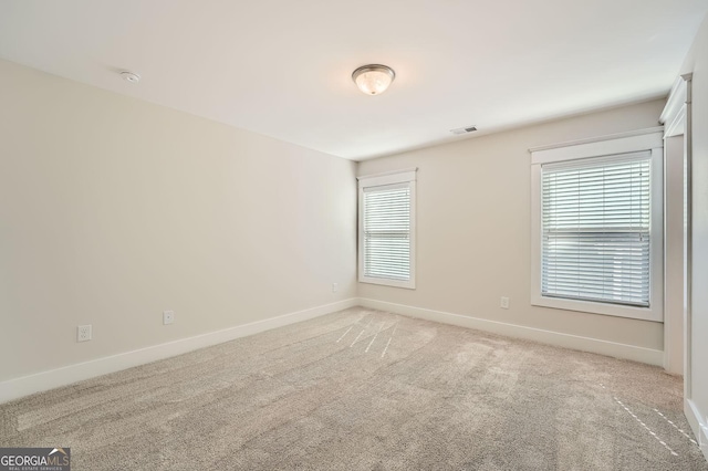 3699 School St, Chamblee, GA 30341 - unfurnished room with baseboards and light colored carpet
