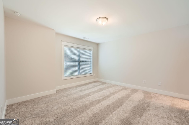 3699 School St, Chamblee, GA 30341 - carpeted spare room with a smoke detector and baseboards