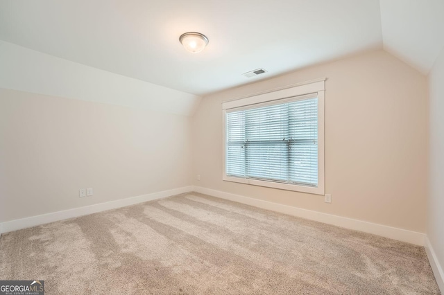 3699 School St, Chamblee, GA 30341 - additional living space with lofted ceiling and carpet floors