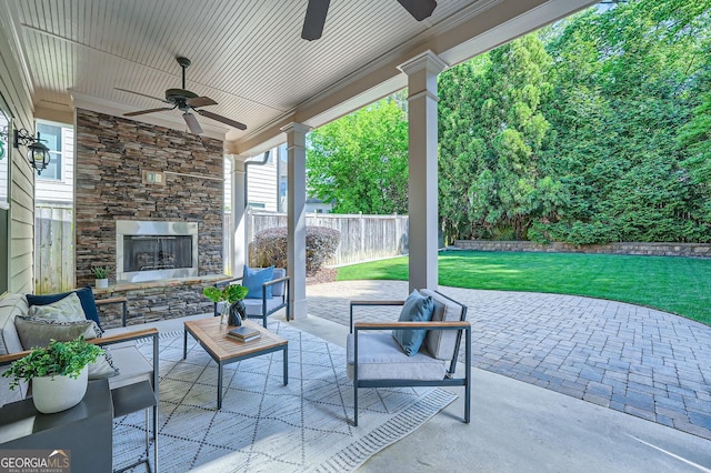 3699 School St, Chamblee, GA 30341 - view of patio / terrace with a ceiling fan and an outdoor living space with a fireplace