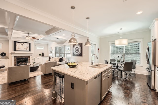 3699 School St, Chamblee, GA 30341 - kitchen featuring appliances with stainless steel finishes, a ceiling fan, dark wood-style floors, light stone countertops, and recessed lighting