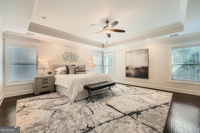 3699 School St, Chamblee, GA 30341 - bedroom featuring a tray ceiling, dark wood-type flooring, multiple windows, recessed lighting, and ornamental molding