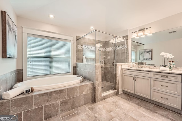 3699 School St, Chamblee, GA 30341 - full bath featuring vanity, a garden tub, a shower stall, and stone finish floors