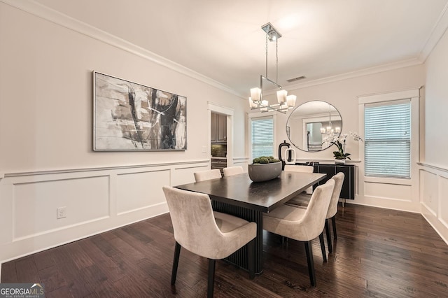 3699 School St, Chamblee, GA 30341 - dining room featuring a chandelier, dark wood-type flooring, a decorative wall, crown molding, and a wainscoted wall