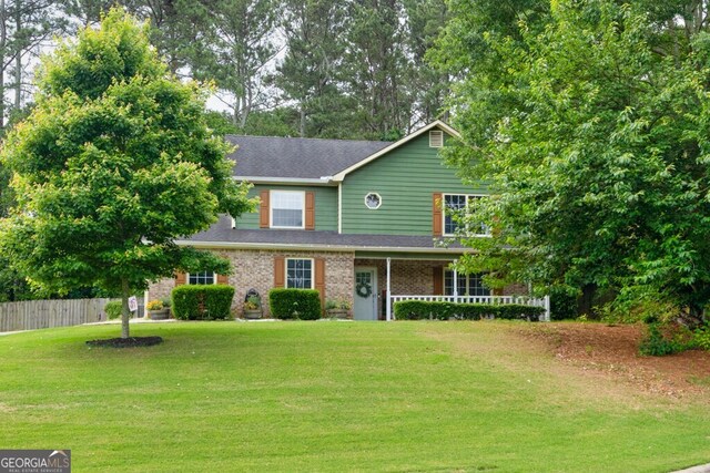3987 Ivory Gables Pl, Buford, GA 30519 - traditional home with roof with shingles and brick siding