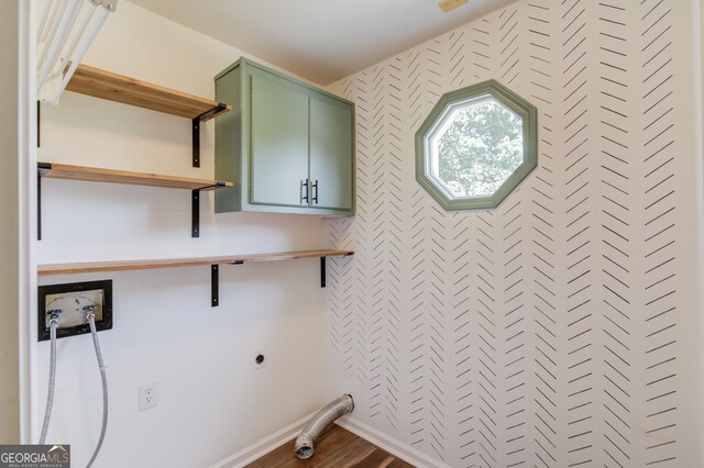 3987 Ivory Gables Pl, Buford, GA 30519 - laundry area with cabinet space, hookup for an electric dryer, hookup for a washing machine, wood finished floors, and baseboards