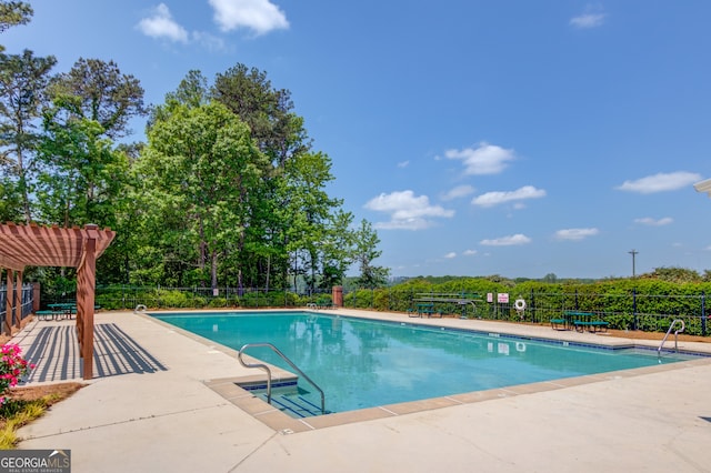 3987 Ivory Gables Pl, Buford, GA 30519 - community pool with fence, a pergola, and a patio area