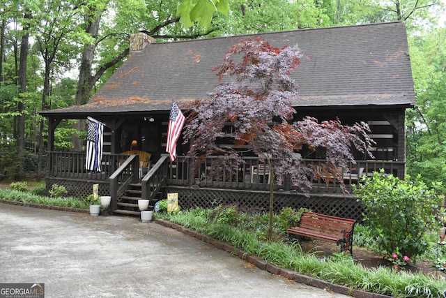 6503 Old Macon Hwy, Rex, GA 30273 - view of front of home with roof with shingles, covered porch, and a chimney