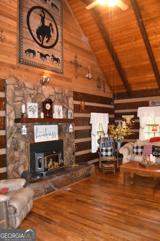 6503 Old Macon Hwy, Rex, GA 30273 - living room with wood walls, wood finished floors, beamed ceiling, and wooden ceiling