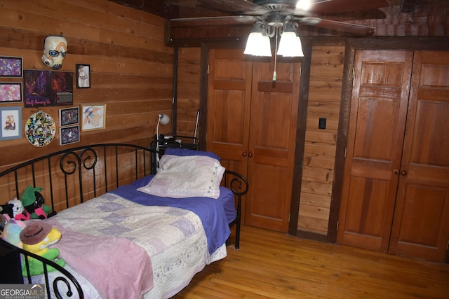 6503 Old Macon Hwy, Rex, GA 30273 - bedroom with wood walls and wood finished floors
