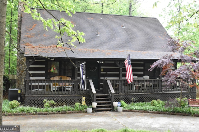 6503 Old Macon Hwy, Rex, GA 30273 - rear view of property featuring a shingled roof, covered porch, and central AC unit