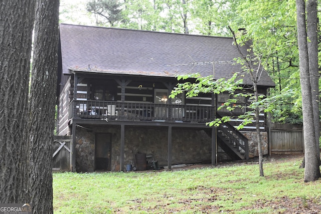 6503 Old Macon Hwy, Rex, GA 30273 - back of house with stairs, a wooden deck, roof with shingles, fence, and a yard