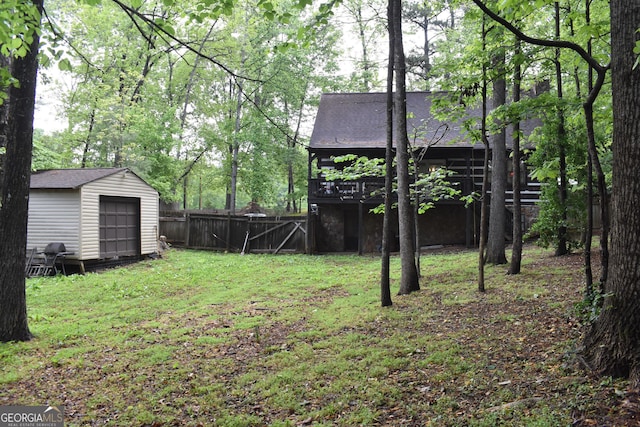 6503 Old Macon Hwy, Rex, GA 30273 - view of yard with fence, a storage unit, a deck, and an outbuilding