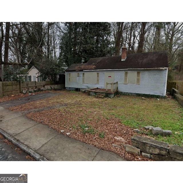 1254 Campbellton Rd SW, Atlanta, GA 30310 - view of front of property featuring a chimney and view of wooded area