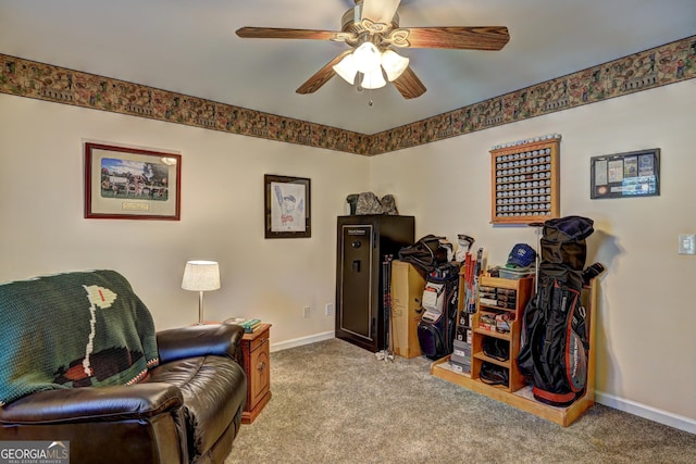 sitting room with ceiling fan, carpet flooring, and baseboards