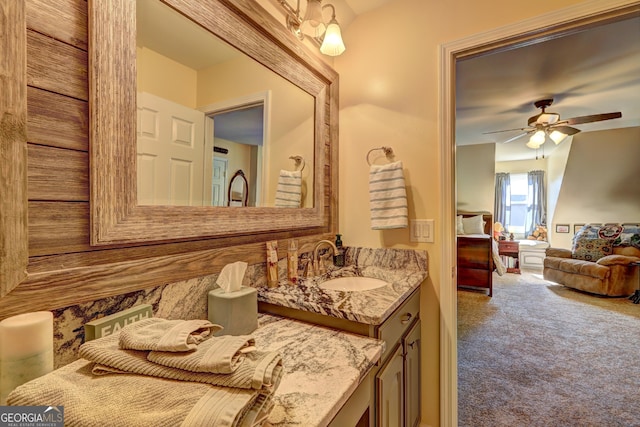 bathroom with ceiling fan and vanity