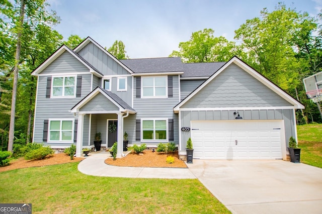 view of front of property featuring board and batten siding, concrete driveway, a garage, and a front lawn