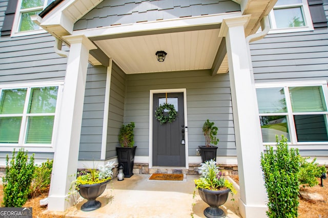 doorway to property with covered porch