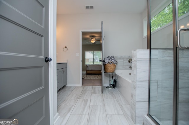bathroom with vanity, a bath, ceiling fan, baseboards, and a shower with shower door