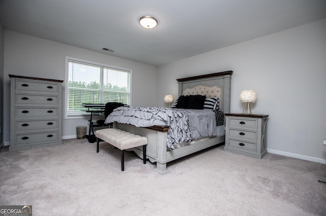 carpeted bedroom featuring baseboards