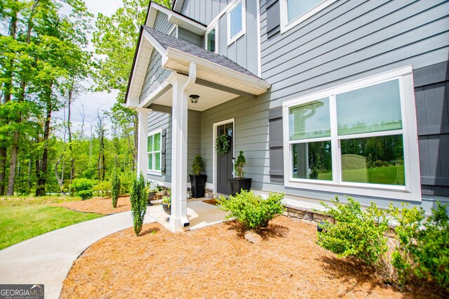 doorway to property with board and batten siding