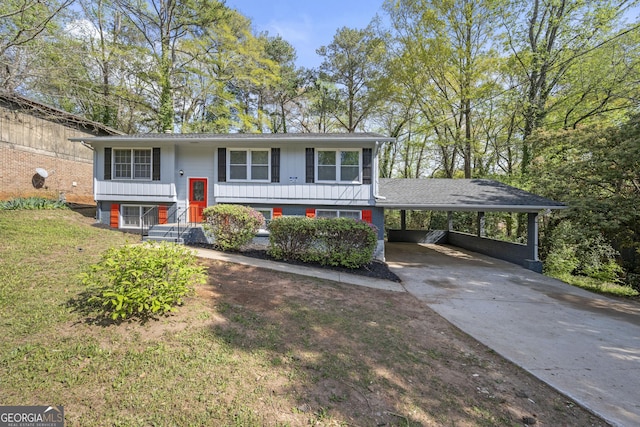 2352 S Hairston Rd, Decatur, GA 30035 - bi-level home with driveway, a front yard, and an attached carport