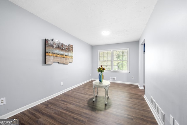 2352 S Hairston Rd, Decatur, GA 30035 - interior space featuring baseboards, visible vents, a textured ceiling, and dark wood-type flooring