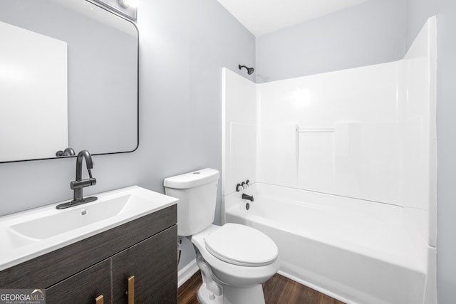 2352 S Hairston Rd, Decatur, GA 30035 - full bathroom featuring vanity, toilet, wood finished floors, and bathtub / shower combination