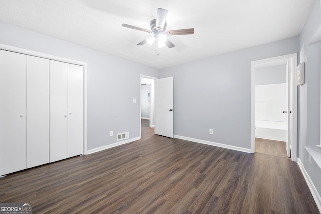 2352 S Hairston Rd, Decatur, GA 30035 - unfurnished bedroom featuring baseboards, a closet, dark wood-style flooring, and visible vents