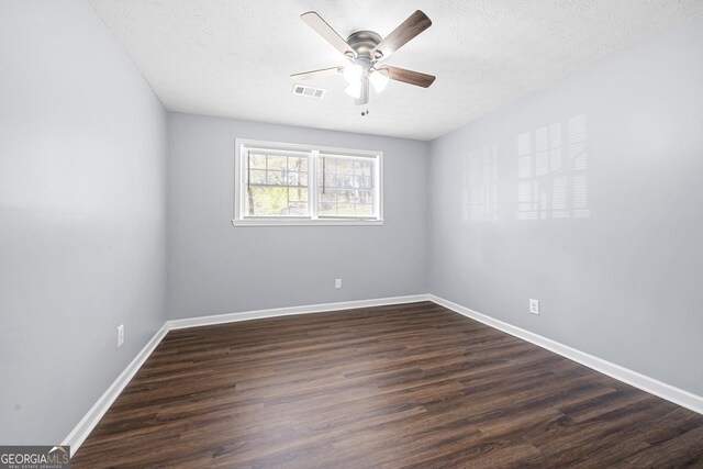 2352 S Hairston Rd, Decatur, GA 30035 - unfurnished room featuring baseboards, ceiling fan, visible vents, and dark wood finished floors