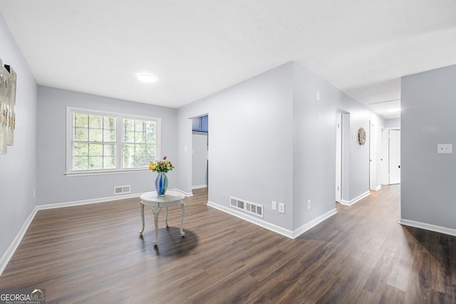 2352 S Hairston Rd, Decatur, GA 30035 - unfurnished room with baseboards, dark wood-style floors, and visible vents