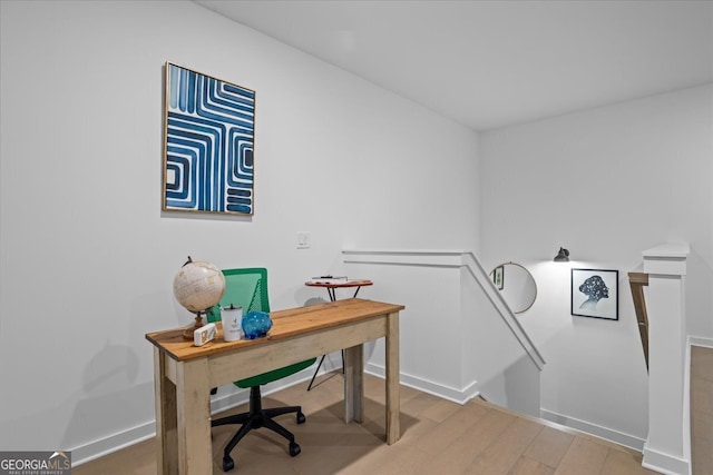 office with wood finished floors and baseboards