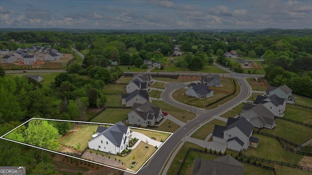bird's eye view with a view of trees and a residential view