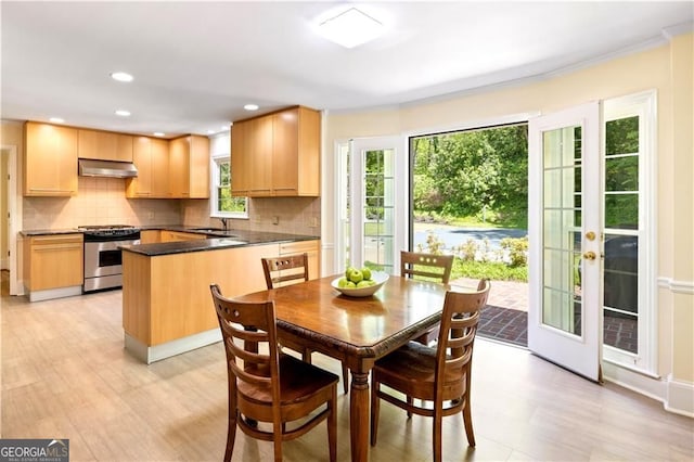 5655 Errol Pl NW, Atlanta, GA 30327 - dining space with light wood-type flooring, recessed lighting, and ornamental molding
