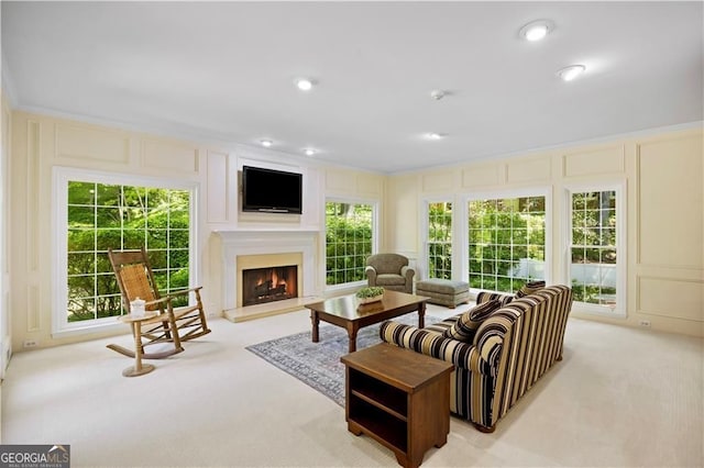 5655 Errol Pl NW, Atlanta, GA 30327 - living room featuring a lit fireplace, carpet floors, and a decorative wall