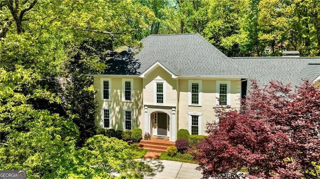 5655 Errol Pl NW, Atlanta, GA 30327 - colonial-style house featuring stucco siding and roof with shingles
