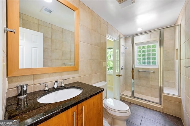 5655 Errol Pl NW, Atlanta, GA 30327 - full bath featuring visible vents, toilet, a stall shower, and tile walls