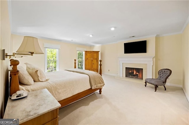 5655 Errol Pl NW, Atlanta, GA 30327 - bedroom featuring baseboards, ornamental molding, light carpet, and a warm lit fireplace