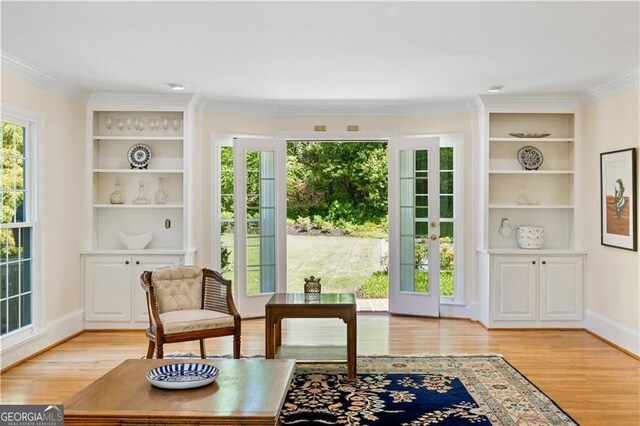 5655 Errol Pl NW, Atlanta, GA 30327 - entryway featuring light wood-style floors, crown molding, and built in features