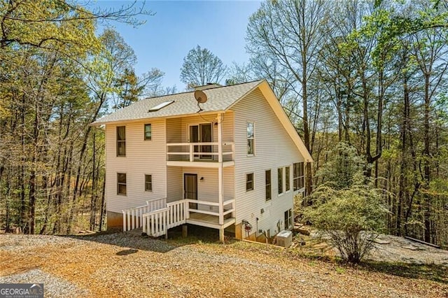 227 River Ridge Rd S, Dahlonega, GA 30533 - back of property featuring roof with shingles and a balcony