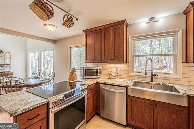 227 River Ridge Rd S, Dahlonega, GA 30533 - living area featuring a tiled fireplace, a towering ceiling, stairway, and wood-type flooring