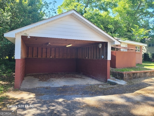 view of side of property featuring a carport