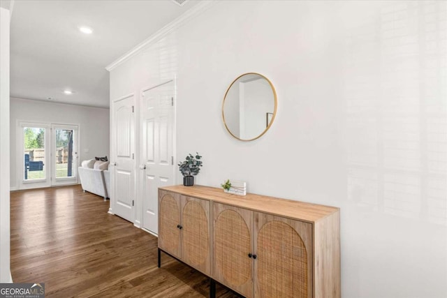 corridor with ornamental molding, dark wood-style flooring, and recessed lighting