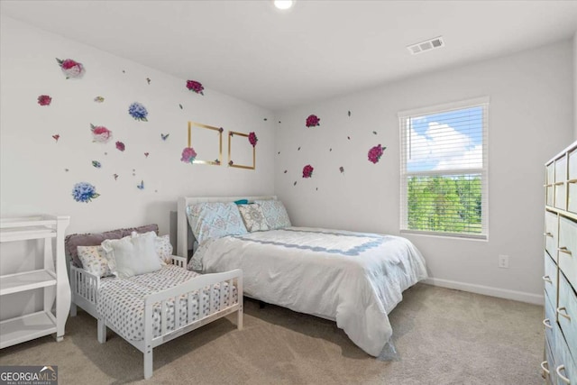bedroom with light carpet and baseboards