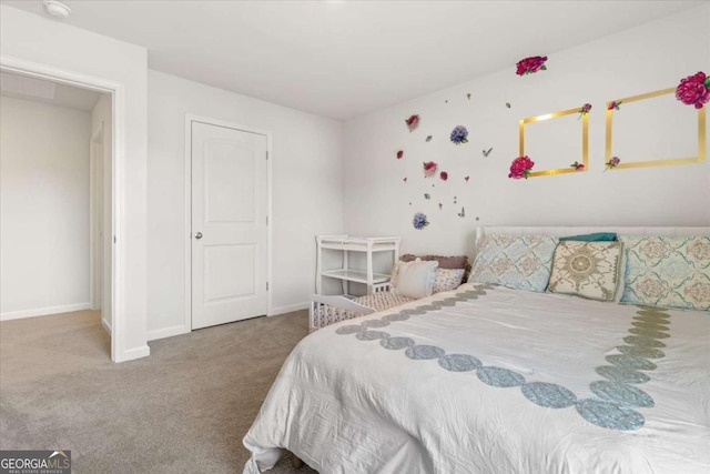 carpeted bedroom featuring baseboards