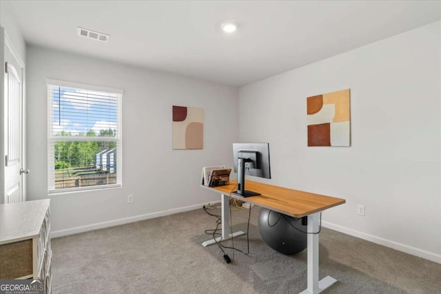 carpeted office space with baseboards